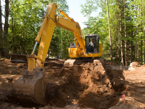 tractor digging up dirt
